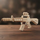 Puzzle 3D en bois représentant une carabine avec canon et viseur.