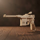 Puzzle 3D en bois représentant un pistolet Mauser avec détails réalistes.