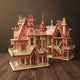 Puzzle 3D en bois d'une villa rose détaillée.