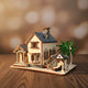Puzzle 3D d'une maison de plage moderne en bois avec toit bleu et palmiers.