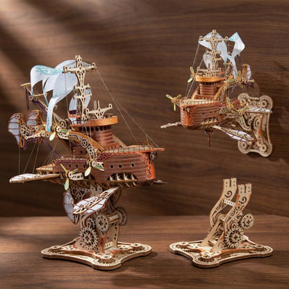 Puzzle 3D en bois d'un vaisseau spatial steampunk avec voiles et engrenages sur un socle. -vue 5