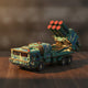Puzzle 3D en bois d'un blindé bleu-vert avec missiles rouges et verts.