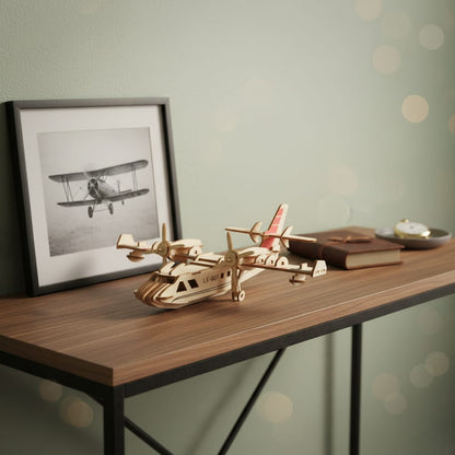 Puzzle 3D du Hydravion en Bois, posé sur une commode dans un intérieur design
