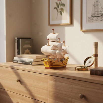 Puzzle 3D du Navire Marchand de Soie, posé sur une commode dans un intérieur design